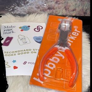 Hobby worker bending plier to bend metal into bracelets for jewelry making